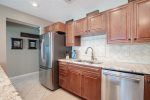 Beautiful, spacious kitchen with stainless steel appliances.